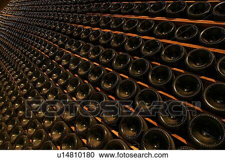 Stock Image - bottles, wine, wine bottles, rows, shelves, array. Fotosearch