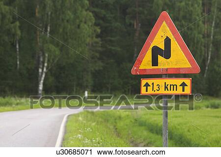 Stock Image - Close-Up, Day, Countryside, Country Road, Arrow Sign. Fotosearch