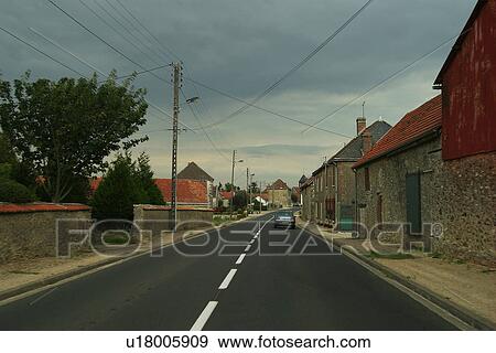 Stock Photo - cloudy, clouds, dawn, dusk, downtown, car. Fotosearch