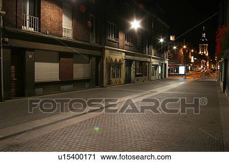 Stock Image - dark, gloomy, lit, lights, street, outdoors. Fotosearch