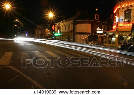 Stock Photo - dark, gloomy, lit, lights, street, outdoors. Fotosearch