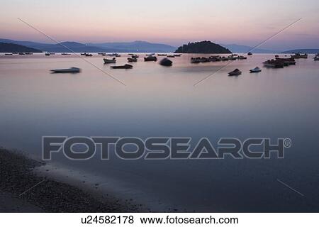 Stock Photo - Boat, Coast, Dusk, Hill, Horizon. Fotosearch