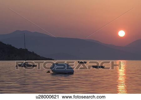 Stock Image - Boat, Dusk, Glow, Lake. Fotosearch