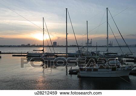 Stock Photo - boats, parked, positioned, sun, dawn, dusk. Fotosearch