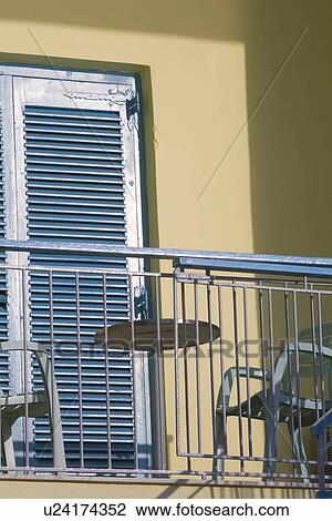Stock Image - Balcony, Building, Chair, Day, Door. Fotosearch