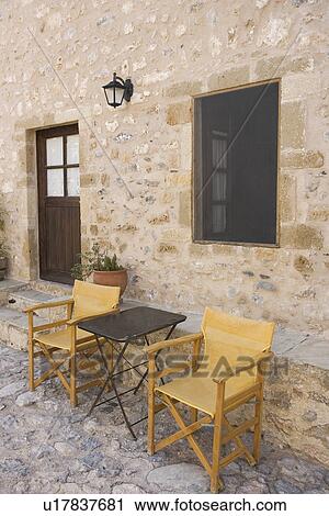 Stock Image - Building Exterior, Building Structure, Chair, Day, Door. Fotosearch