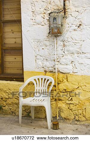 Stock Image - Chair, Day, Doors, Electric Meter, Electric Wiring. Fotosearch
