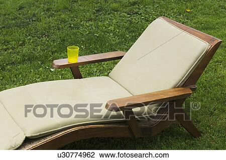 Stock Image - Cushion, Front Or Back Yard, Empty, Day, Armrest. Fotosearch