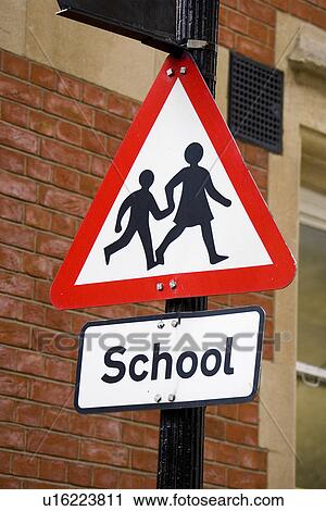 Stock Image - Brick Wall, Close-Up, Directional Sign. Fotosearch