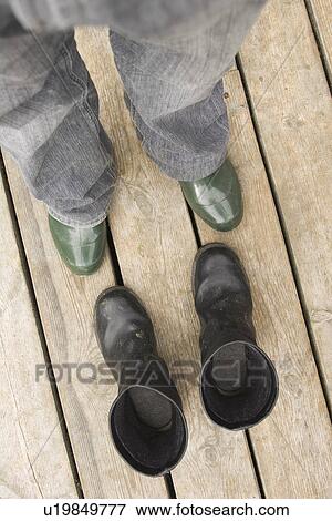 Stock Photo - Boots, Close-Up, Directly Above, Human Leg, Jeans. Fotosearch