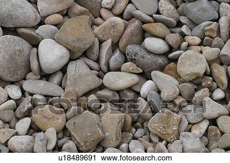 Stock Image - rocks, stones, rocky, pebbles, surface, texture. Fotosearch