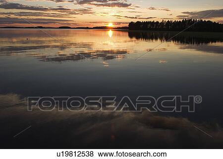 Stock Photo - Climate, Drowning, Dawn, Clouds, Amber Light. Fotosearch