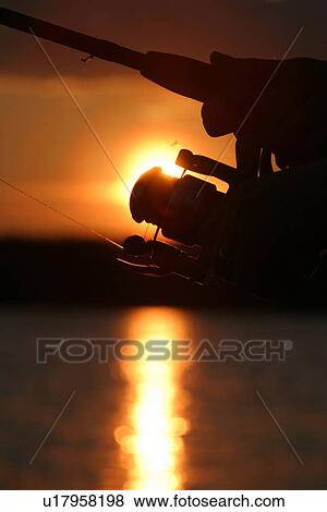 Stock Photo - fishing reel, reel, line, nylon line, nature, natural. Fotosearch