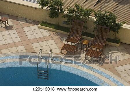Stock Photo - Day, Hand Rail, Lounge Chair. Fotosearch