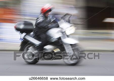 Stock Photo - Blurred, Day, Driving, Helmet. Fotosearch