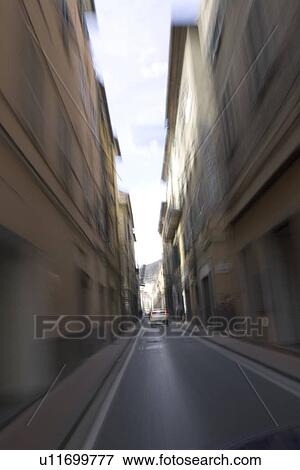 Stock Photo - Cloud, Blurred Motion, Car, Building Structure, Building Exterior, Alley. Fotosearch