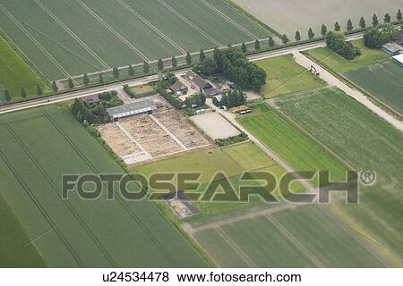 Stock Photo - Cultivated, Field, Farm House, Farm, Aerial View. Fotosearch