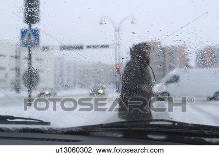 Stock Image - rainy day, roadside, cars, van, transportation. Fotosearch