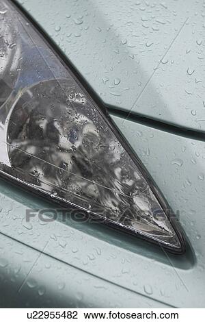 Stock Image - car, vehicle, headlights, automobile, raindrops, drops. Fotosearch