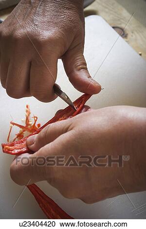 Stock Image - Chilies, Close-Up, Cutting, Food, Holding. Fotosearch