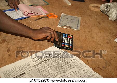 Stock Image - person, hand, holding, calculator, bill, calculations. Fotosearch