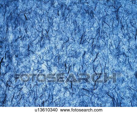 Stock Image - Japanese paper colored blue, close up. Fotosearch