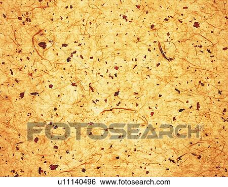 Stock Photograph - Japanese paper colored orange with spots, close up. Fotosearch