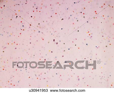 Stock Image - Japanese paper colored pink with spots, close up. Fotosearch