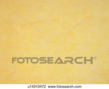 Stock Image - Japanese paper colored yellow, close up. Fotosearch