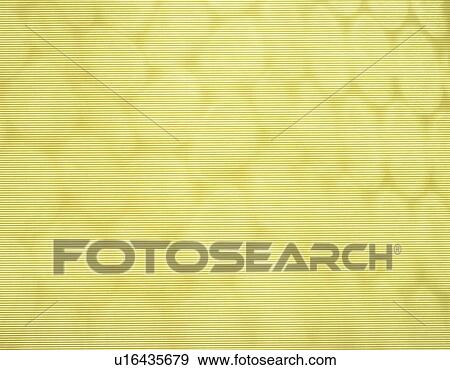Stock Photo - Japanese paper colored yellow with dots, close up. Fotosearch