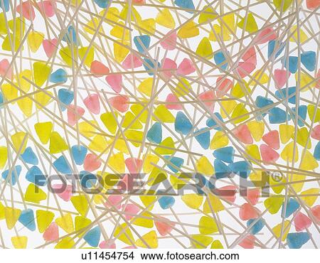 Picture - Mass of candies with sticks. Fotosearch