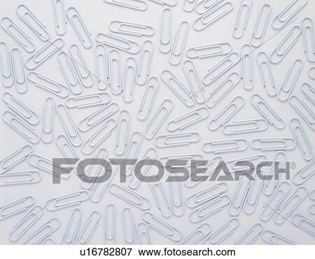Stock Photo - Mass of clips in white. Fotosearch
