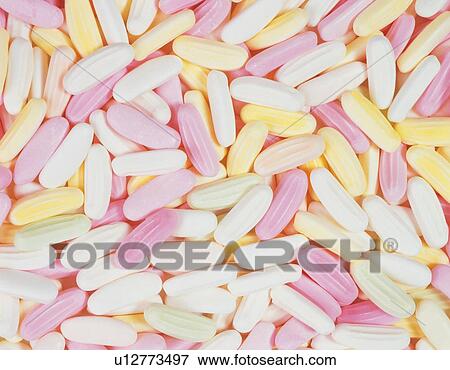 Mass of elliptical sugar candies View Large Photo Image Stock Photo - Mass of elliptical sugar candies. Fotosearch