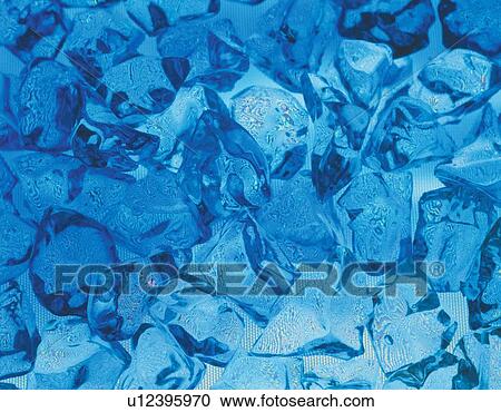 Stock Image - Mass of glass cullet colored blue. Fotosearch