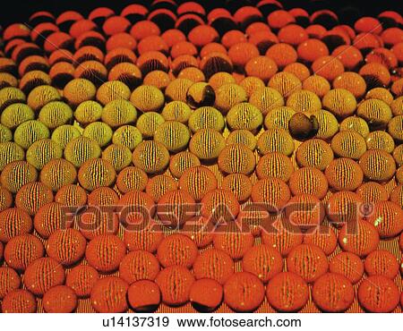 Mass of marbles in orange and yellow View Large Photo Image Stock Photo - Mass of marbles in orange and yellow. Fotosearch