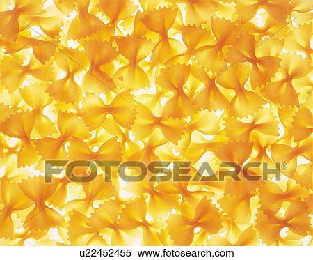 Mass of ribbon pasta, farfalle View Large Photo Image Stock Photography - Mass of ribbon pasta, farfalle. Fotosearch