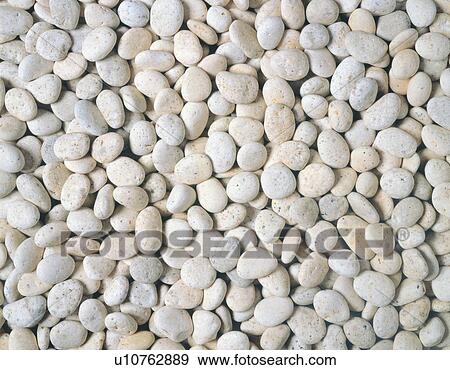 Mass of rounded stones in white View Large Photo Image Stock Photo - Mass of rounded stones in white. Fotosearch