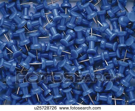 Stock Photograph - Mass of thumbtacks in blue. Fotosearch