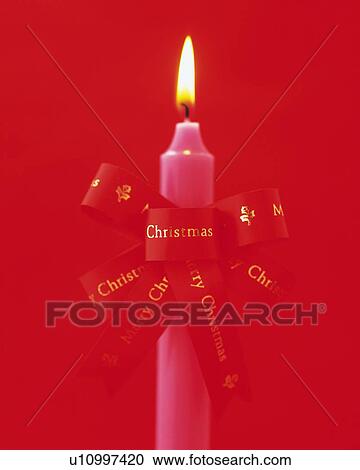 Stock Image - Burning Candle Wrapped By Ribbon, Front View, Close Up. Fotosearch