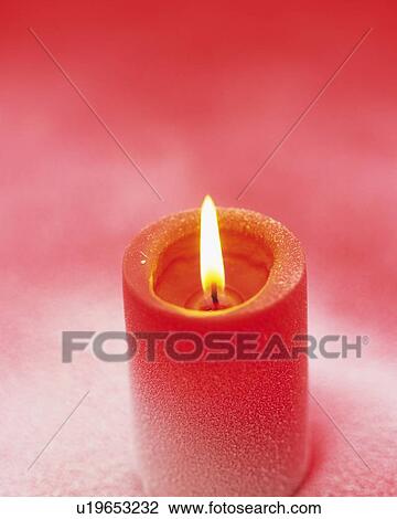 Stock Image - Burning Red Candle, High Angle View, Close Up, Differential Focus, In Focus, Out Focus. Fotosearch