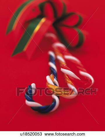 Stock Image - Candy Sticks and Ribbon, Close Up, Differential Focus, In Focus, Out Focus. Fotosearch