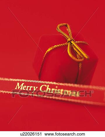 Stock Image - Christmas Gift and Ribbon, High Angle View, Close Up, Differential View, In Focus, Out Focus. Fotosearch