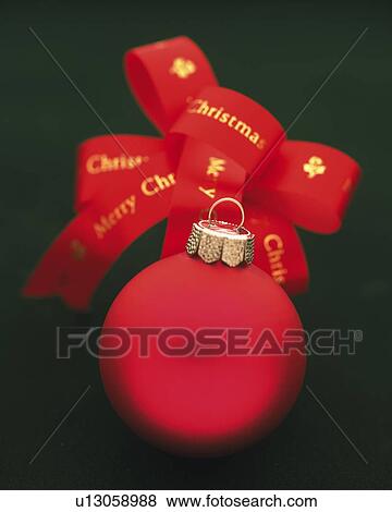 Stock Photo - Christmas Ornament and Ribbon, Close Up, Front View, Differential Focus, In Focus, Out Focus. Fotosearch