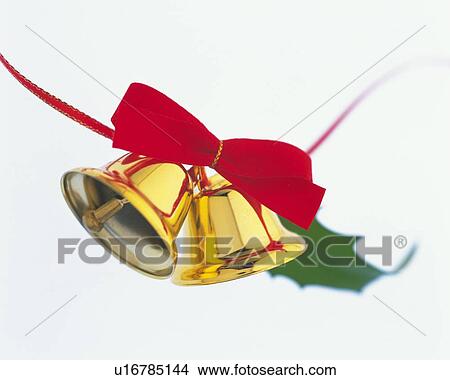 Gold Bells and Holly Tied with Red Ribbon, Close Up, Low Angle View, Differential Focus, In Focus, Out Focus View Large Photo Image Picture - Gold Bells and Holly Tied with Red Ribbon, Close Up, Low Angle View, Differential Focus, In Focus, Out Focus. Fotosearch