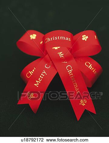 Merry Christmas Printed on Red Ribbon, High Angle View, Close Up View Large Photo Image Stock Image - Merry Christmas Printed on Red Ribbon, High Angle View, Close Up. Fotosearch
