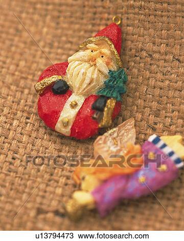 Stock Image - Ornament of Santa Claus and Angel, High Angle View, Close Up, Differential Focus, In Focus, Out Focus. Fotosearch