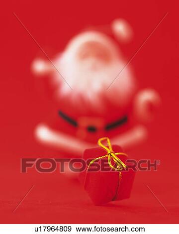 Stock Photo - Present Box and Santa Claus, Front View, Close Up, Differential Focus, In Focus, Out Focus. Fotosearch