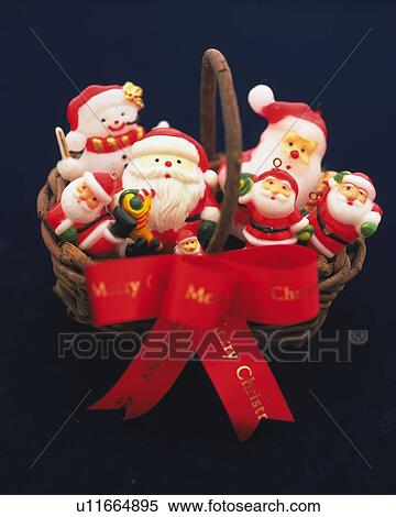 Stock Photography - Santa Claus Ornaments in Basket, High Angle View, Close Up. Fotosearch