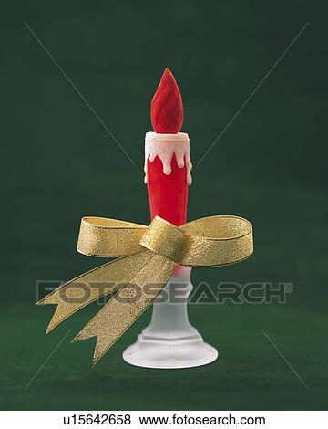Stock Photo - Toy Candle Wrapped By Gold Ribbon, Front View, Close Up. Fotosearch