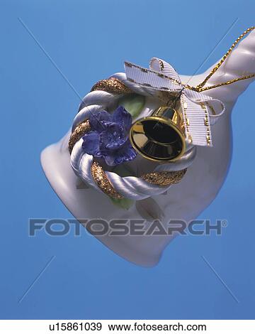 Stock Photo - White Bell and Wreath Ornament, Close Up, Side View. Fotosearch